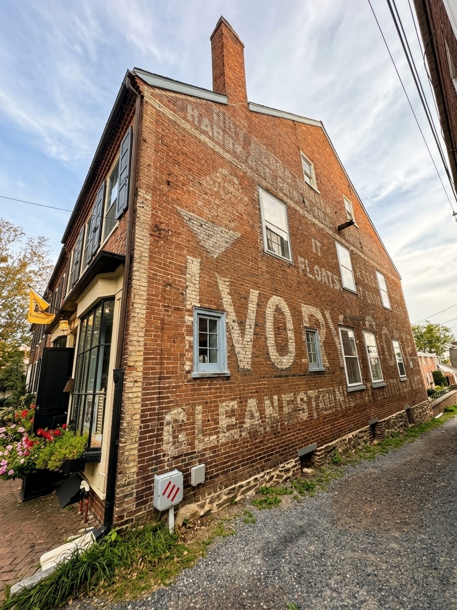 Historic Brick Building with a Faded Ivory Soap Ghost Sign in Old New Castle, Delaware